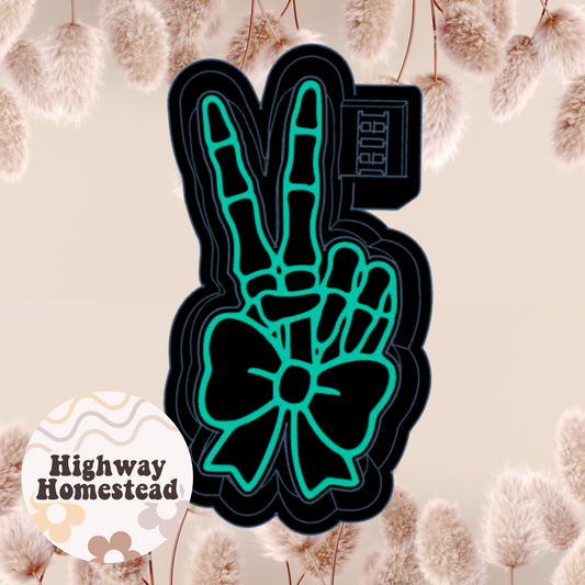 Skelly Hand with Bow Freshie Mold